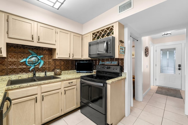 kitchen with sink, appliances with stainless steel finishes, backsplash, and light tile patterned flooring