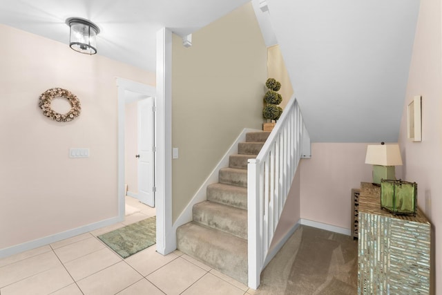 stairs with tile patterned floors