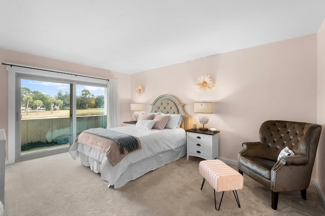 carpeted bedroom featuring access to outside