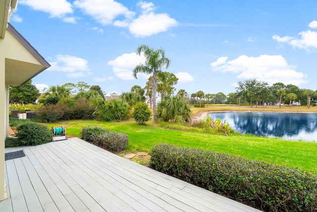 deck featuring a yard and a water view