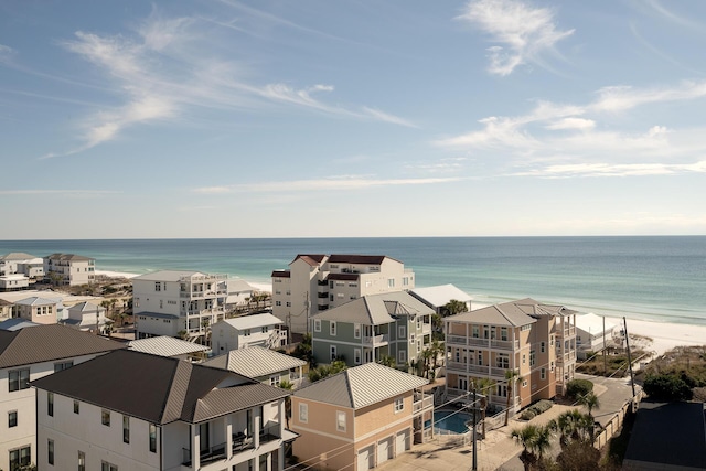 bird's eye view featuring a water view and a view of the beach