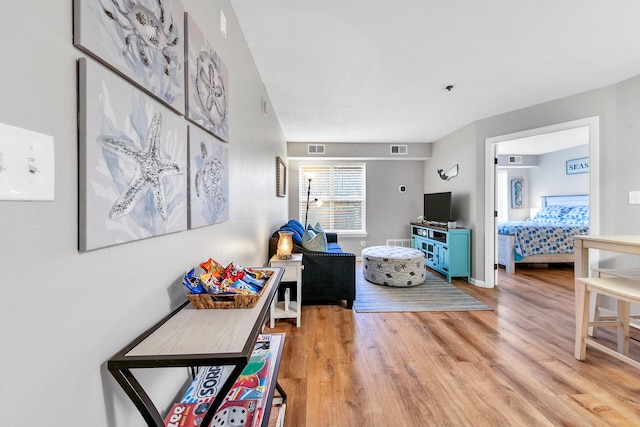 living room with light hardwood / wood-style floors