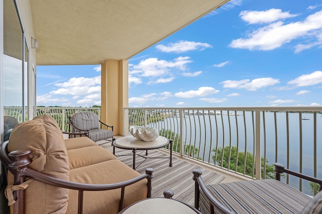 balcony featuring a water view