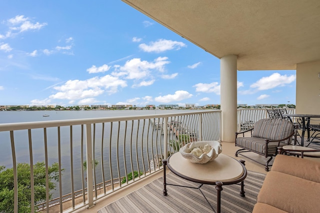 balcony featuring a water view