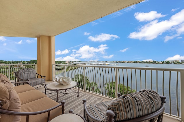 balcony featuring a water view