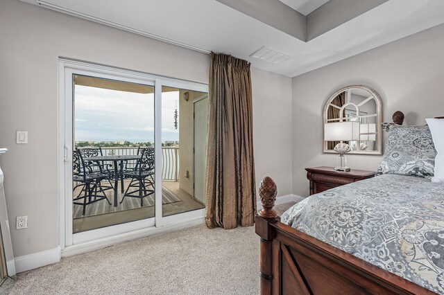 bedroom with carpet flooring and access to outside