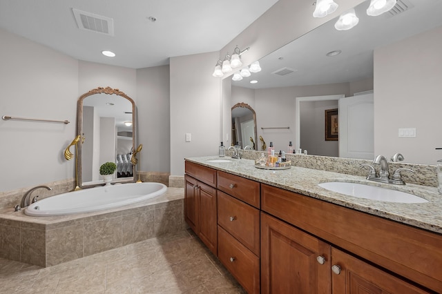 bathroom with vanity and tiled bath