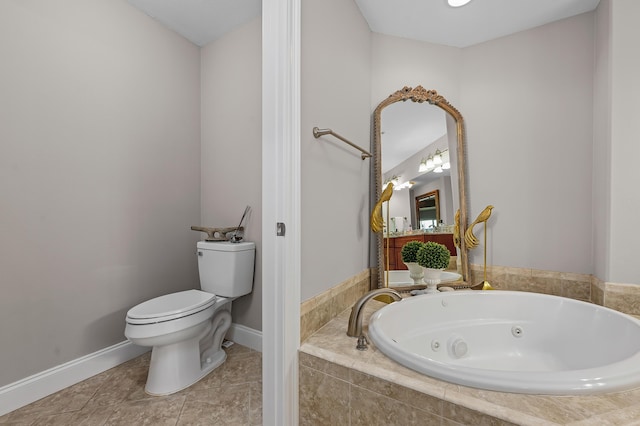 bathroom featuring tile patterned floors, a relaxing tiled tub, and toilet