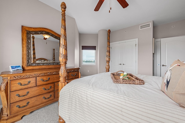 bedroom with a closet, light colored carpet, and ceiling fan