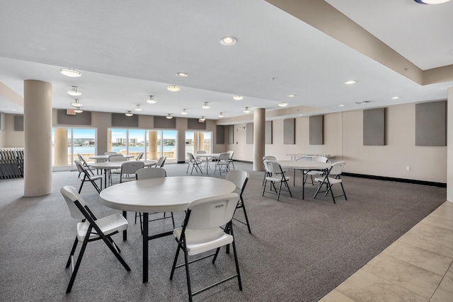 dining space with light colored carpet