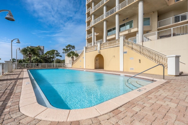 view of pool featuring a patio area