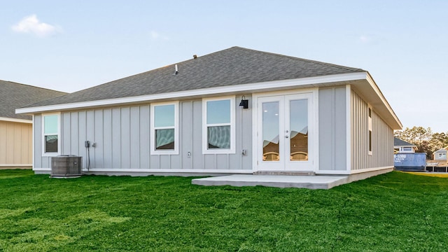 232 Laurel Hill St, Crestview, FL 32539 - rear view of house featuring french doors, central AC, and a lawn