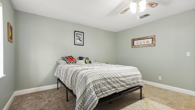 carpeted bedroom with ceiling fan