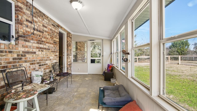 sunroom / solarium with vaulted ceiling