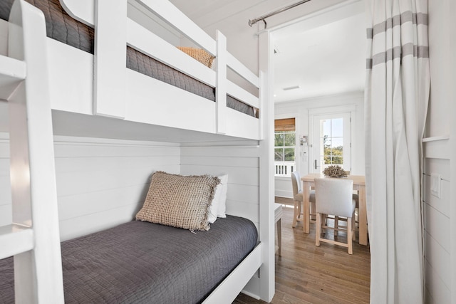 bedroom with hardwood / wood-style flooring