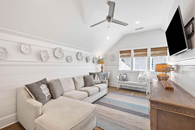 living room with hardwood / wood-style floors, vaulted ceiling, and ceiling fan