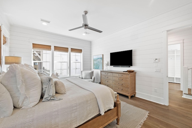 bedroom with ceiling fan and dark hardwood / wood-style flooring