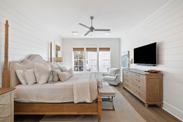 bedroom featuring ceiling fan and hardwood / wood-style flooring