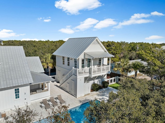 exterior space with a patio and a balcony