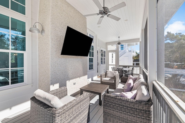 exterior space with ceiling fan and wood ceiling