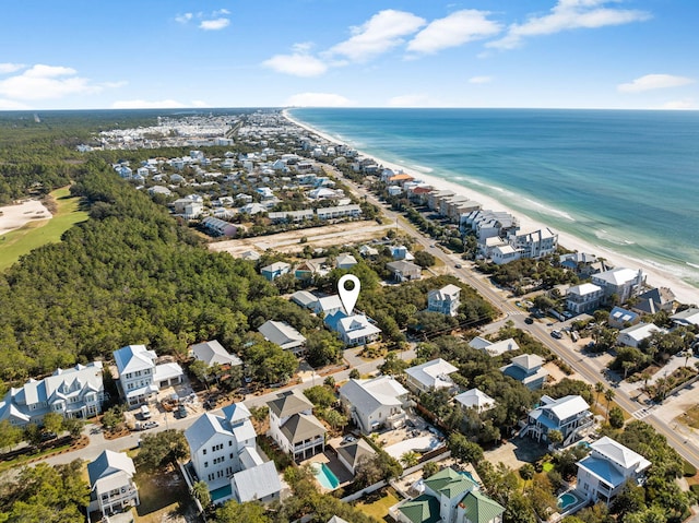 drone / aerial view with a water view and a beach view