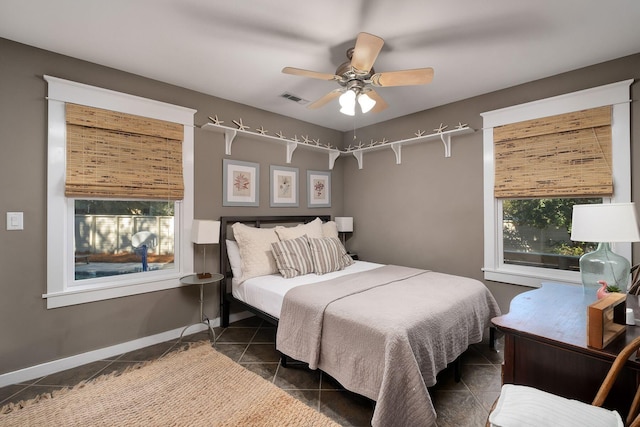 tiled bedroom with ceiling fan