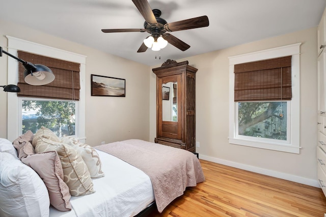 bedroom featuring ceiling fan and light hardwood / wood-style floors