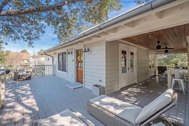 wooden terrace featuring ceiling fan