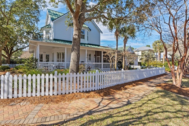 rear view of property featuring a porch