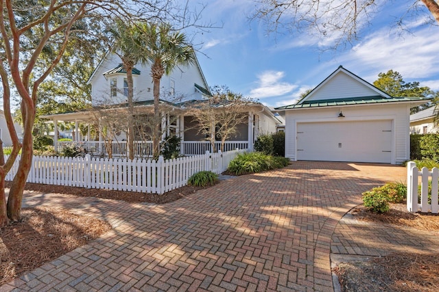 view of front facade with a porch and a garage