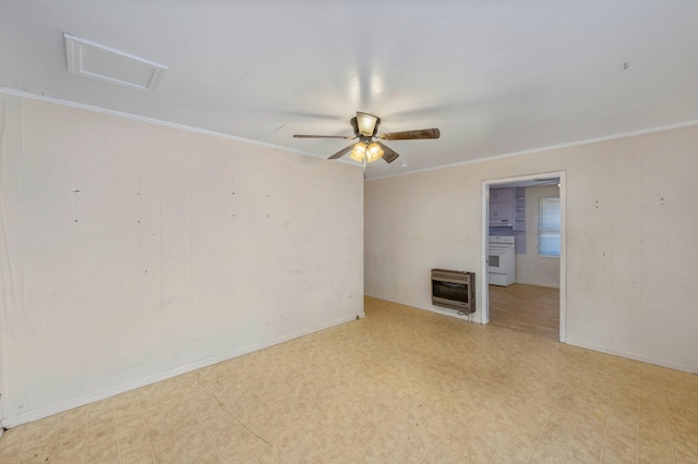 unfurnished room with heating unit, ornamental molding, and ceiling fan