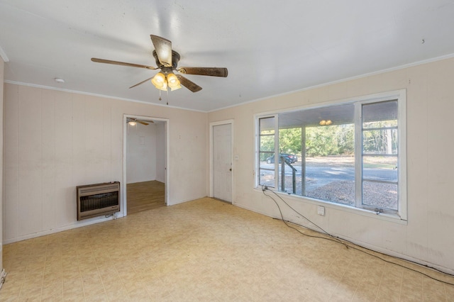 unfurnished living room with crown molding, ceiling fan, and heating unit