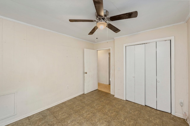 unfurnished bedroom with crown molding, ceiling fan, and a closet