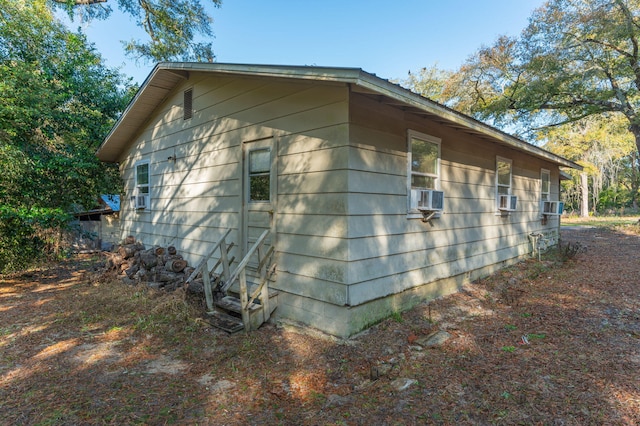 view of side of property featuring cooling unit