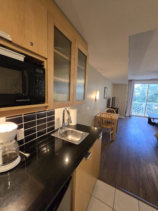 kitchen featuring tasteful backsplash, light brown cabinetry, sink, and light tile patterned flooring