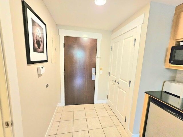 doorway featuring light tile patterned floors