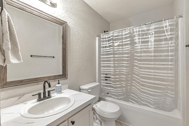 full bathroom featuring vanity, shower / bath combination with curtain, a textured ceiling, and toilet