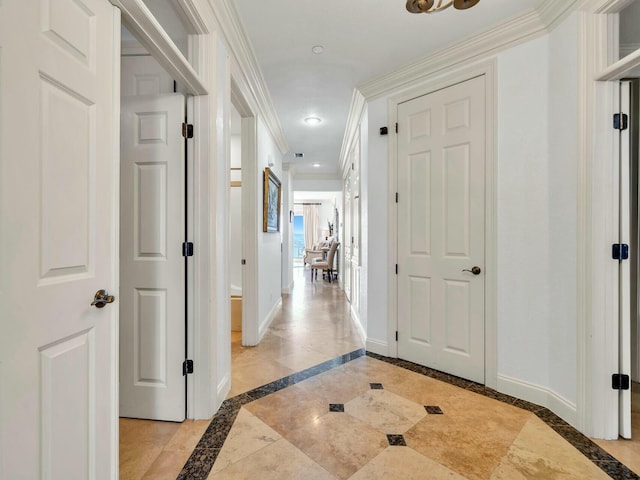 corridor featuring crown molding