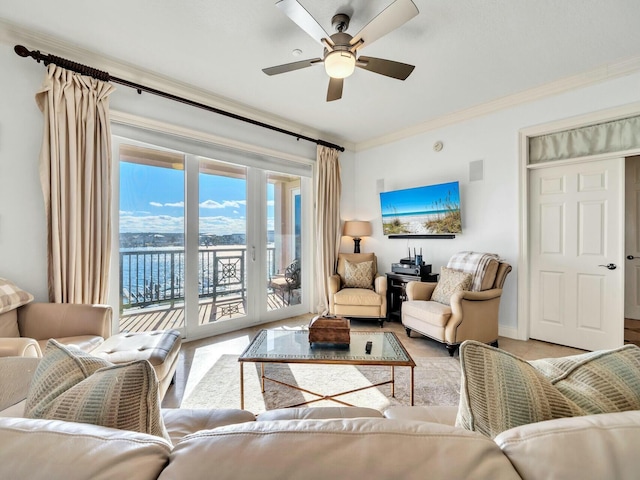 living room with ceiling fan and ornamental molding