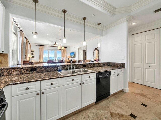 kitchen with pendant lighting, sink, white cabinetry, and black dishwasher