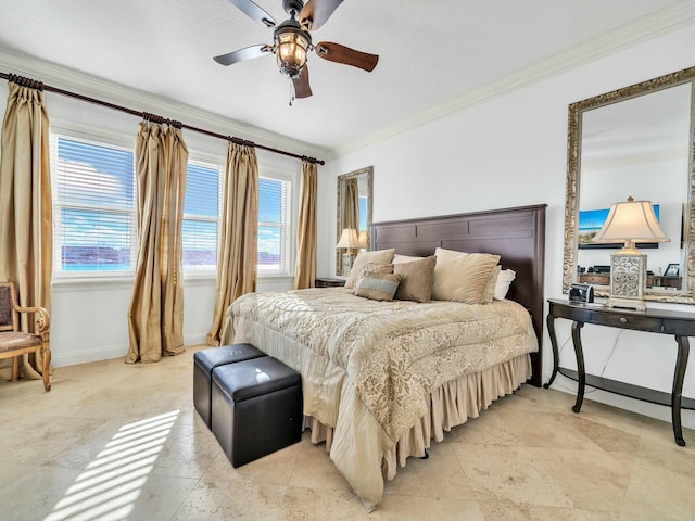 bedroom with ceiling fan and crown molding