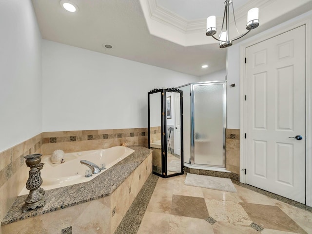 bathroom featuring a raised ceiling, separate shower and tub, a notable chandelier, and ornamental molding