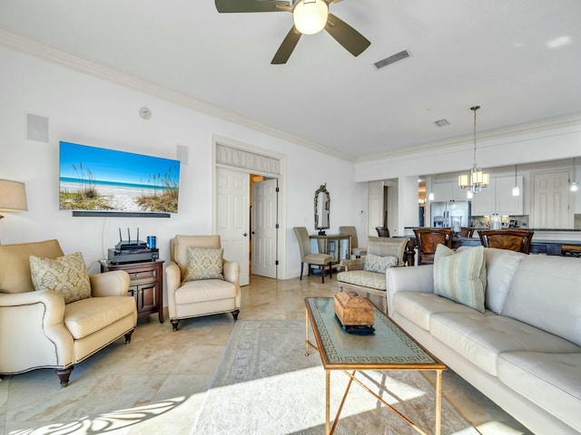 living room with ceiling fan with notable chandelier and crown molding