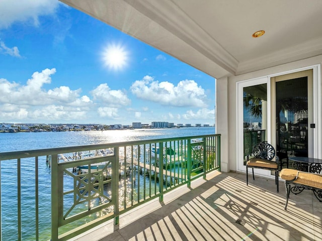 balcony featuring a water view