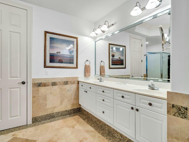 bathroom with vanity and crown molding