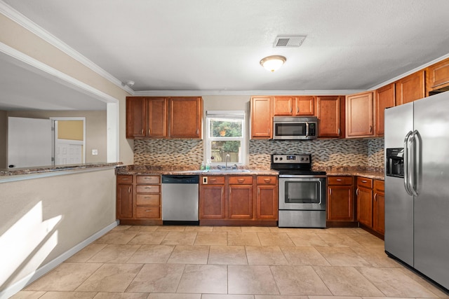 kitchen featuring sink, light stone counters, crown molding, decorative backsplash, and appliances with stainless steel finishes