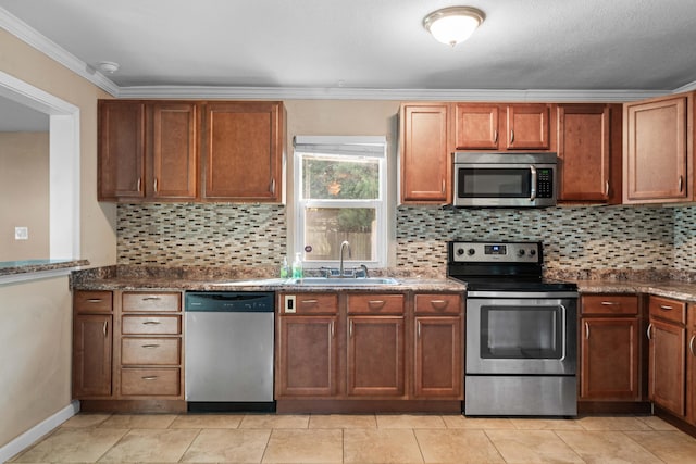 kitchen with crown molding, sink, appliances with stainless steel finishes, and tasteful backsplash