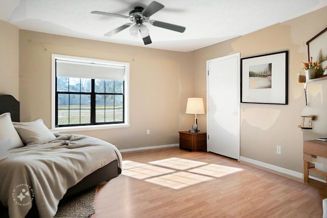 bedroom featuring ceiling fan and light hardwood / wood-style floors