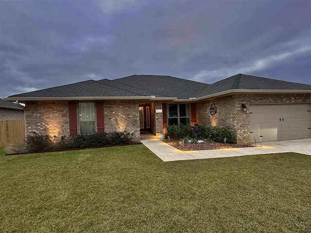 view of front of house with a garage and a front yard