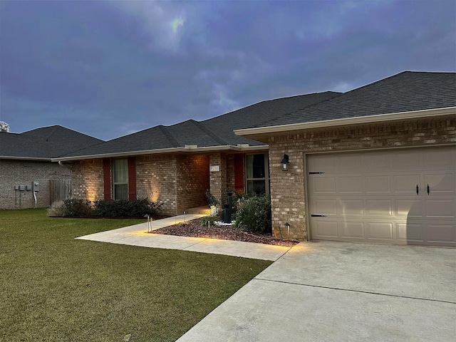 view of front facade with a garage and a front lawn